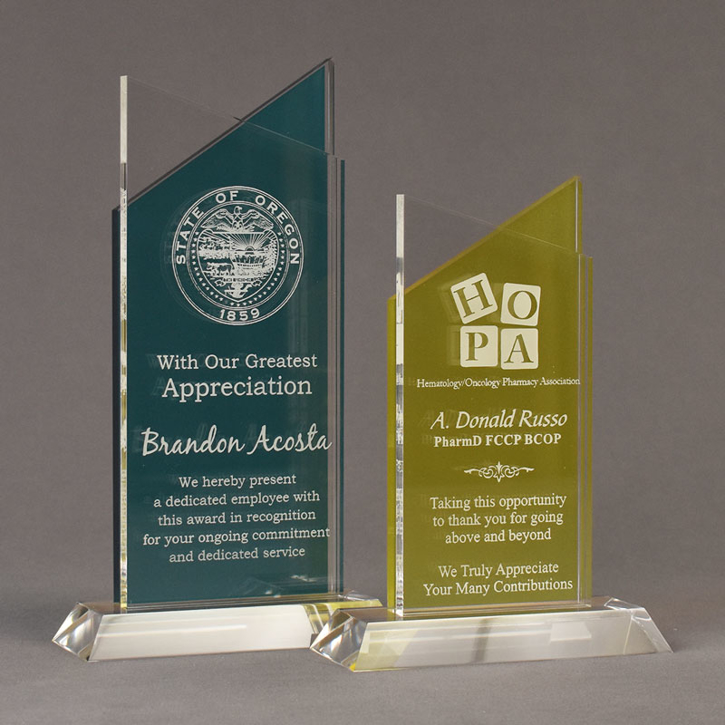 To colorful Lucent™ Candescent shaped acrylic trophy awards.